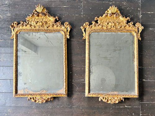 A Pair of Very Fine 18th Century Italian Giltwood Mirrors with Original Plates