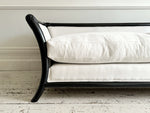 A Napoleon III Large Three Seater Ebonised Sabre Legged Sofa