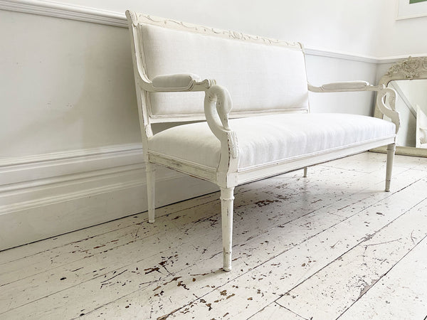 A Charles X Painted White Sofa with Swan Head Carving