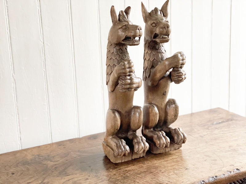 A Pair of 17th C Carved Oak Devil Dogs