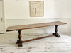 A Single Plank Walnut Top Italian Baroque Trestle Table - 9' Long