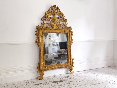 An 18th C Italian Piedmont Carved Giltwood Mirror