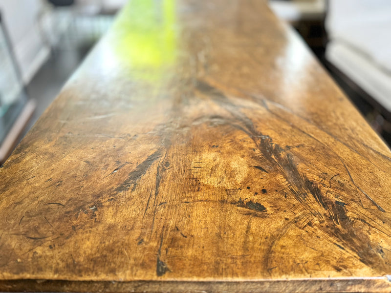 An 18th C Spanish Single Plank Walnut Top Dining Table with Ironwork Beneath