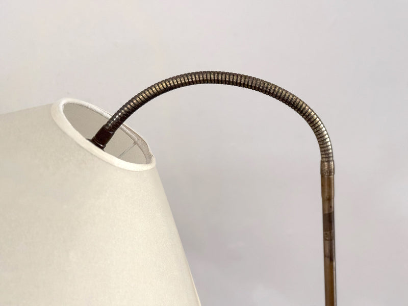 A 1950's French Adjustable Brass Reading Lamp with Parchment Shade