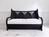 A 1950's French Black Rattan Sculptural Sofa with Piqué Upholstery