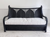 A 1950's French Black Rattan Sculptural Sofa with Piqué Upholstery