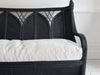 A 1950's French Black Rattan Sculptural Sofa with Piqué Upholstery