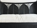 A 1950's French Black Rattan Sculptural Sofa with Piqué Upholstery