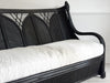 A 1950's French Black Rattan Sculptural Sofa with Piqué Upholstery