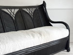 A 1950's French Black Rattan Sculptural Sofa with Piqué Upholstery