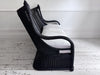 A 1950's French Black Rattan Sculptural Sofa with Piqué Upholstery