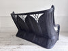 A 1950's French Black Rattan Sculptural Sofa with Piqué Upholstery