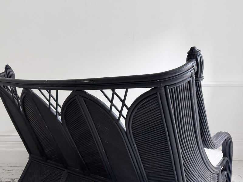 A 1950's French Black Rattan Sculptural Sofa with Piqué Upholstery