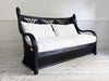 A 1950's French Black Rattan Sculptural Sofa with Piqué Upholstery