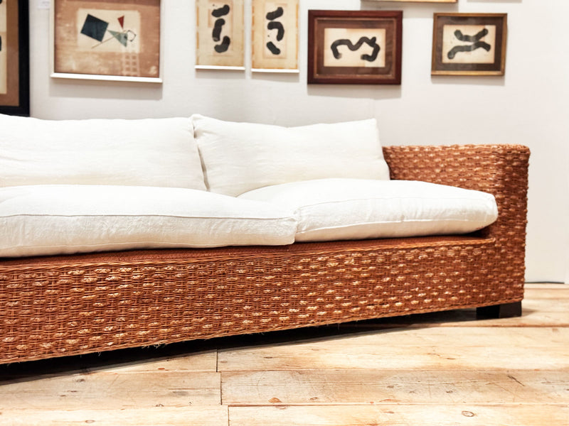 A 1970's French Raffia Rattan Three Seater Sofa