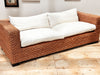 A 1970's French Raffia Rattan Three Seater Sofa