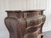A 1970's French Rattan Bombe Commode