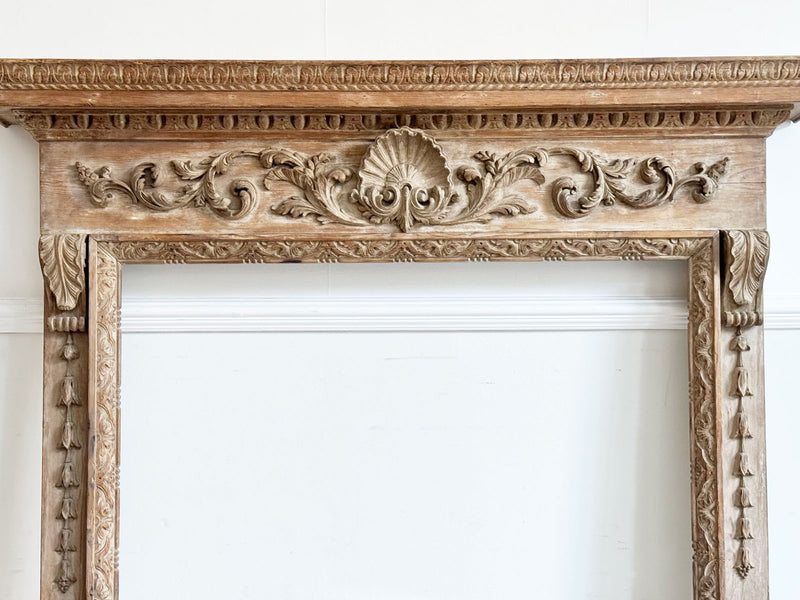 An 18th Century Georgian Pine Fireplace with Shell Carving