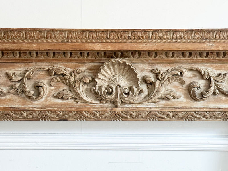 An 18th Century Georgian Pine Fireplace with Shell Carving