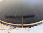 A 1920's Regency Style Ebonised Extending Dining Table