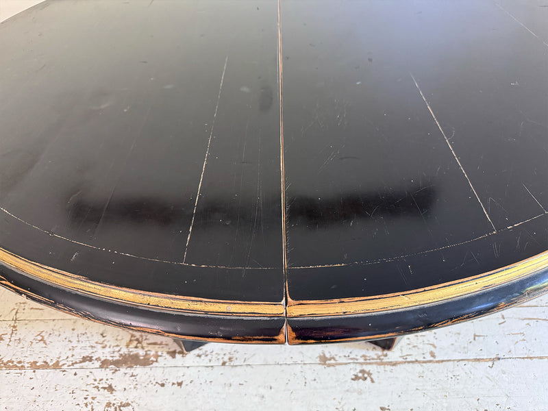 A 1920's Regency Style Ebonised Extending Dining Table