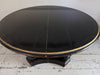 A 1920's Regency Style Ebonised Extending Dining Table