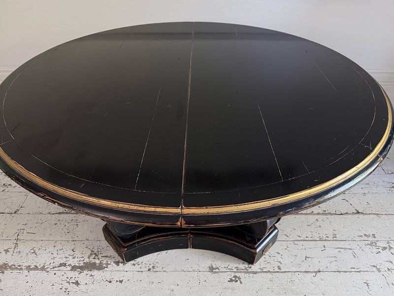 A 1920's Regency Style Ebonised Extending Dining Table