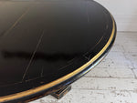 A 1920's Regency Style Ebonised Extending Dining Table