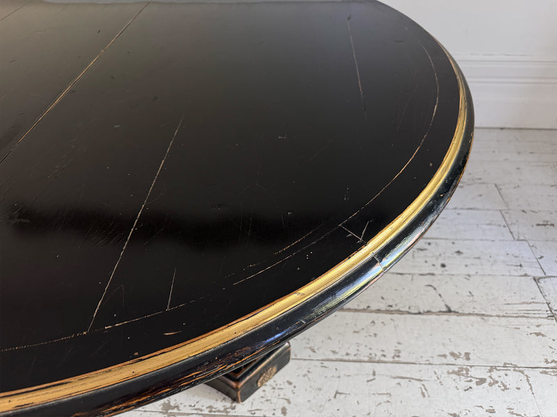 A 1920's Regency Style Ebonised Extending Dining Table