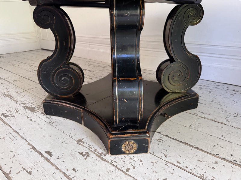 A 1920's Regency Style Ebonised Extending Dining Table