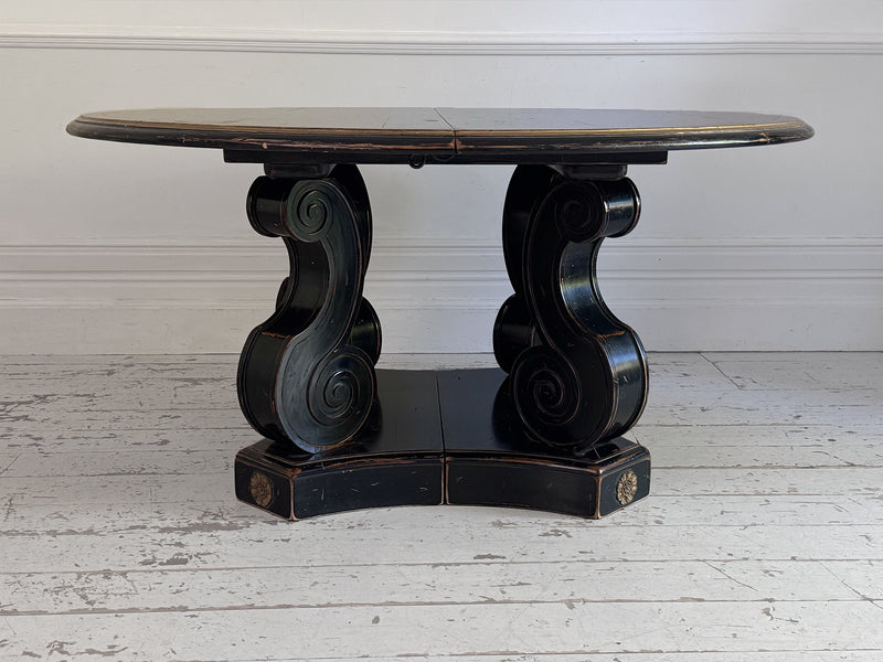 A 1920's Regency Style Ebonised Extending Dining Table