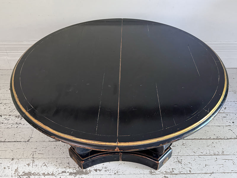 A 1920's Regency Style Ebonised Extending Dining Table