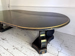 A 1920's Regency Style Ebonised Extending Dining Table