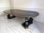 A 1920's Regency Style Ebonised Extending Dining Table
