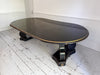 A 1920's Regency Style Ebonised Extending Dining Table
