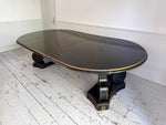 A 1920's Regency Style Ebonised Extending Dining Table