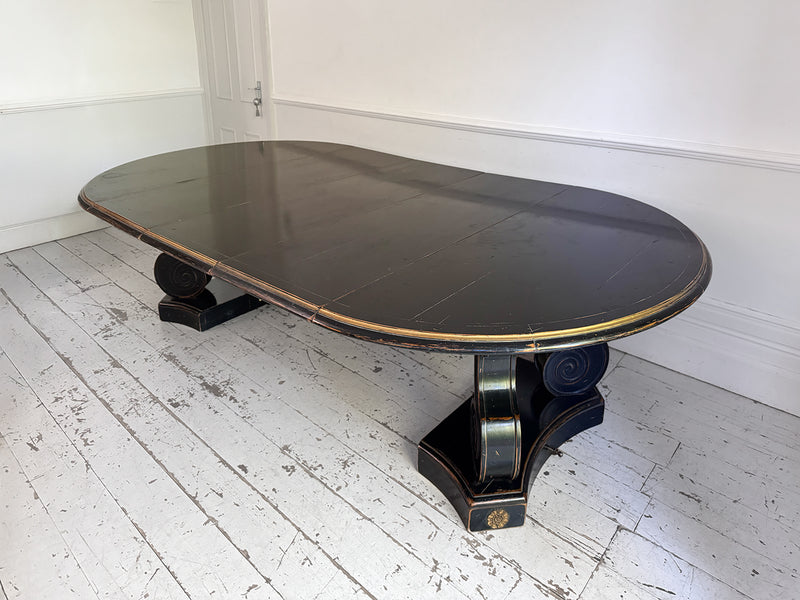 A 1920's Regency Style Ebonised Extending Dining Table
