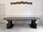 A 1920's Regency Style Ebonised Extending Dining Table