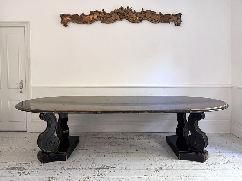 A 1920's Regency Style Ebonised Extending Dining Table