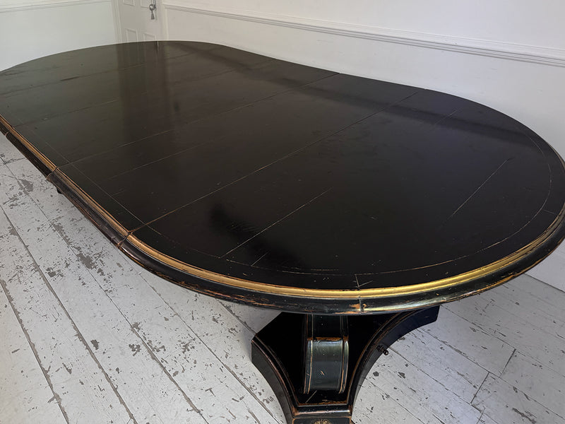 A 1920's Regency Style Ebonised Extending Dining Table