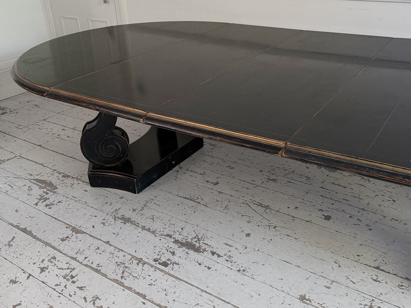 A 1920's Regency Style Ebonised Extending Dining Table