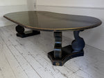 A 1920's Regency Style Ebonised Extending Dining Table