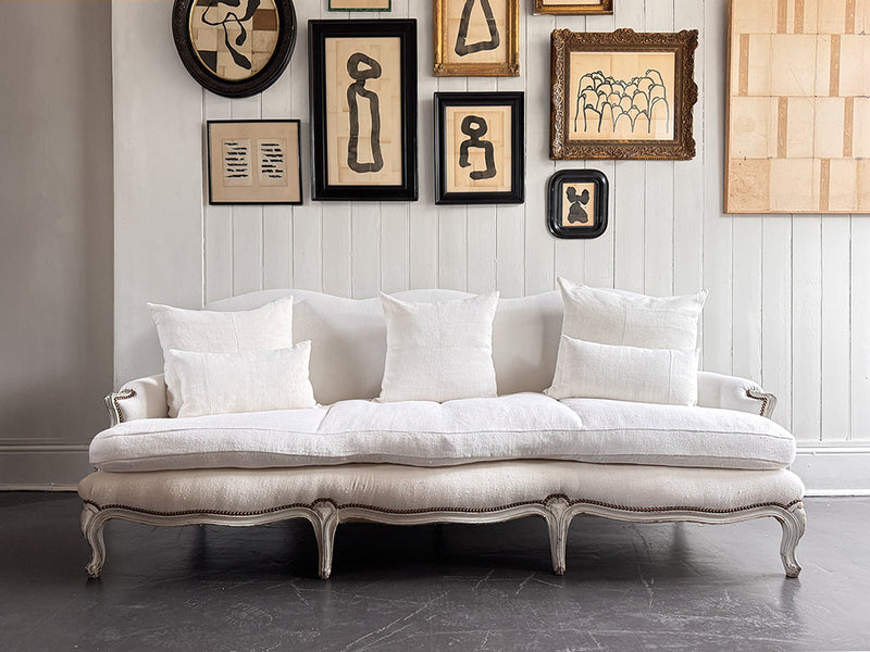 A 19th C French Camel Back Sofa with Serpentine Front