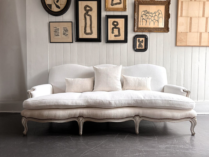 A 19th C French Camel Back Sofa with Serpentine Front