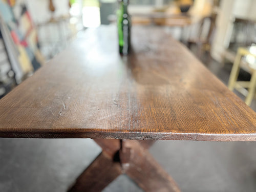 An Late 19th Century French Pine Sawbuck Trestle Table