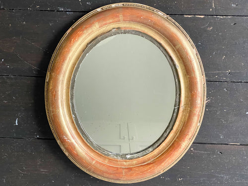 A Small Oval Giltwood Mirror with Original Plate