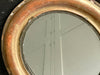 A Small Oval Giltwood Mirror with Original Plate