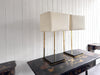 A Pair of Large 1970's Brass Plated Table Lamps on Rippled Black Bases