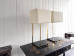 A Pair of Large 1970's Brass Plated Table Lamps on Rippled Black Bases