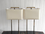 A Pair of Large 1970's Brass Plated Table Lamps on Rippled Black Bases